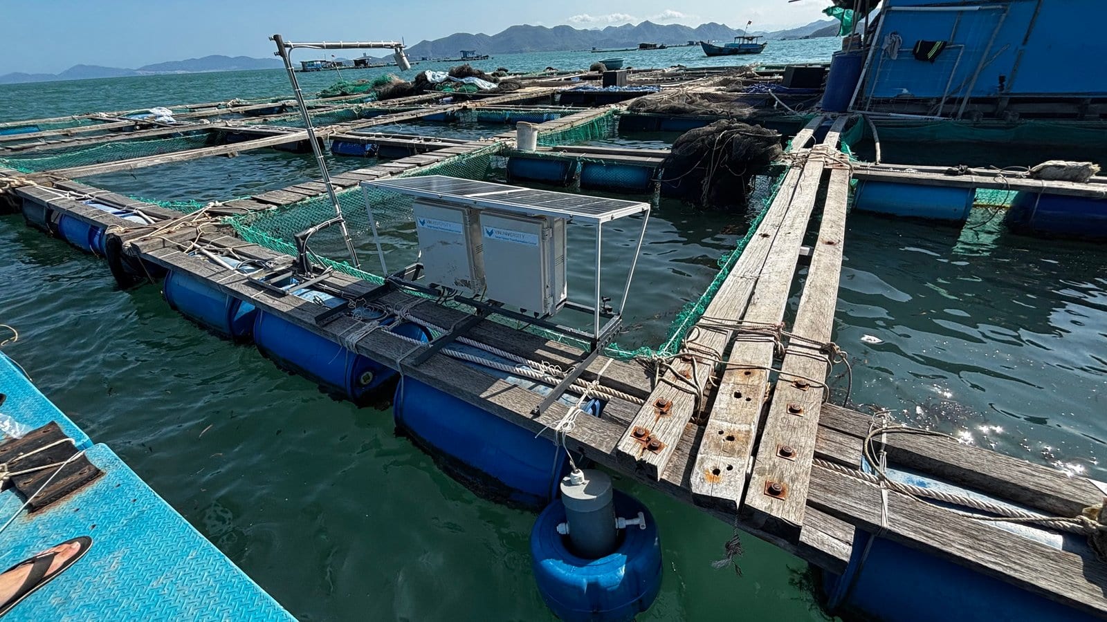 Offshore floating sea cages in Nha Phu Bay with solar station